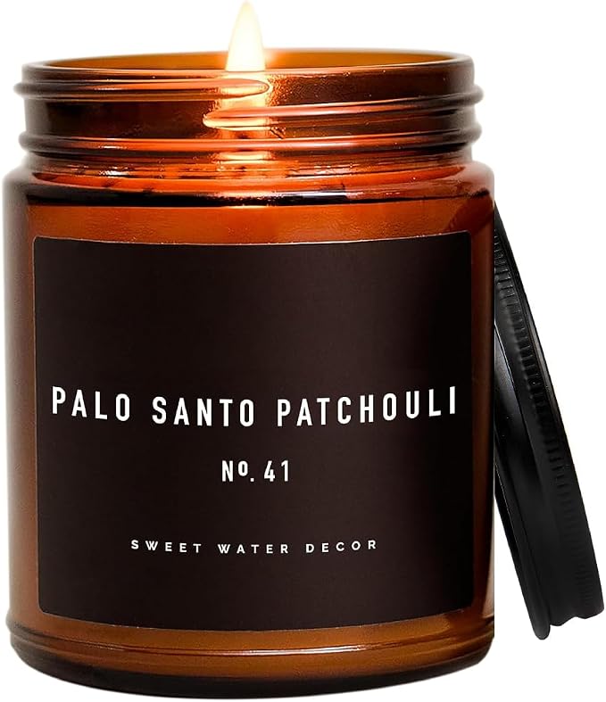 Sweet Water Decor Palo Santo Patchouli Candle - Vanilla, Musk, Sandalwood, Patchouli Scented Soy Spa Candles for Home - Gifts for Women, Men - 9oz Amber Jar, 40 Hour Burn Time
