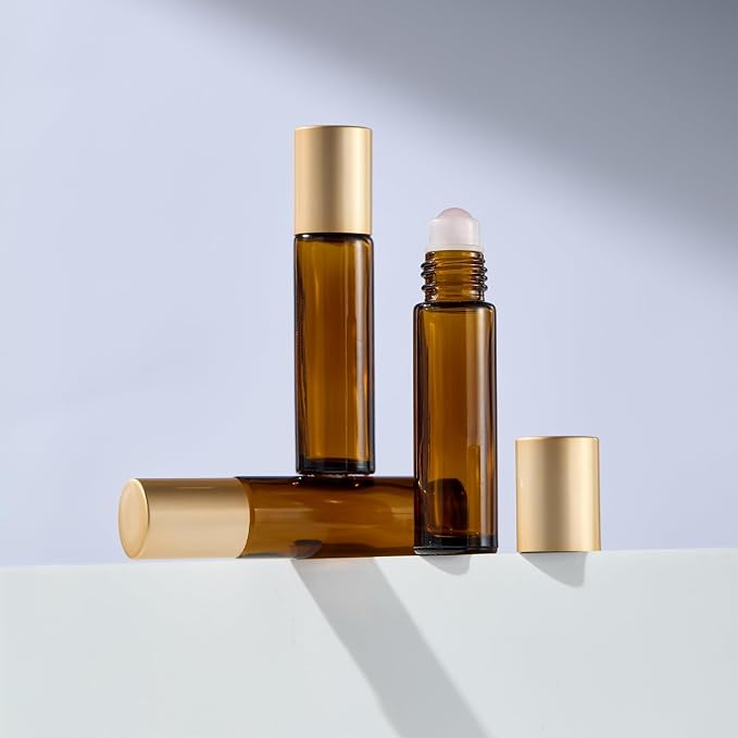 Qeuly 6 Pack Rose Quartz Roller Bottles for Essential Oils, 10ml Amber Glass Roll on Bottles with Natural Crystal Balls, Leak-Proof Travel Size Perfume Roller Bottle (Amber)