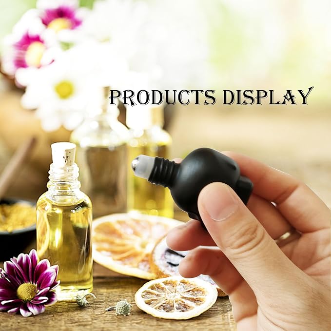 7 pcs Set 10ml Mini Skull Glass Oil Roller Bottles Leakproof Essential Oils Bottle for Storage and Travel (black)